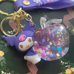 Kuromi holding glitter filled Apple Keychain